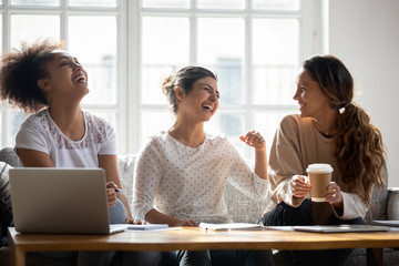 Multiracial female students having fun at meeting at home.