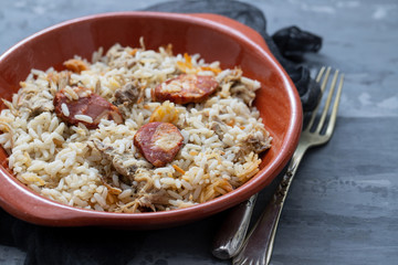 typical portuguese dish rice with duck and smoked sausage