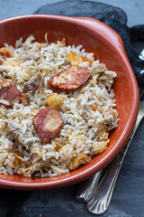 typical portuguese dish rice with duck and smoked sausage