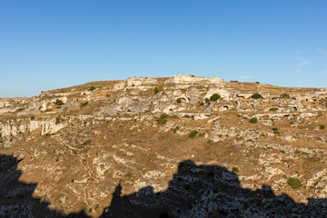 View of Gravina river canyon and park of the Rupestrian Churches of Matera with houses in caves di Murgia Timone near ancient town Matera (Sassi), , Basilicata,  Italy