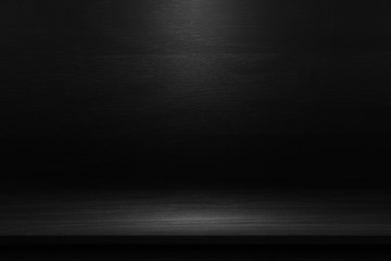 Black table in the dark background. 