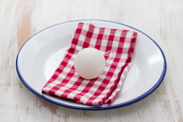 dish with napkin and Christmas toy on ceramic background