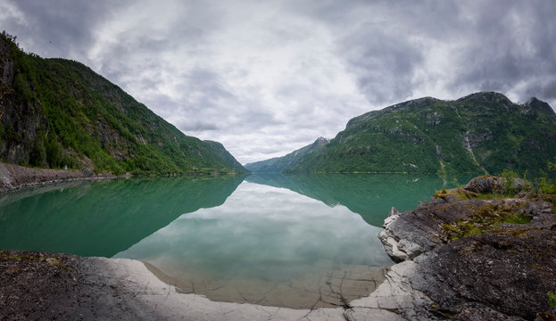 Wide panorama of glacial fed lake Norway