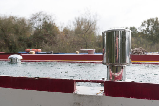 Close Up Of Wood Burner Chimney On Barge With Smoke