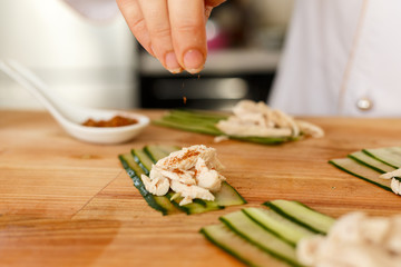 the process of making a snack of cucumber and chicken