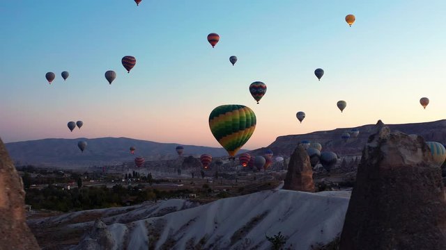 Early morning silhouetted hot air balloons against the skies of Goreme Cappadocia, Turkey