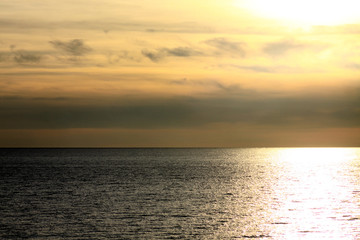 Naklejka na ściany i meble beautiful sunset over the sea