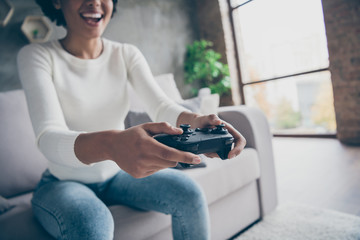 Cropped photo of funny dark skin lady playing video games addicted hold modern joystick football...