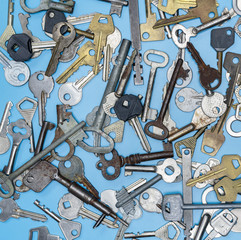 Keys set on blue background. Door lock keys and safes for property security and house protection....