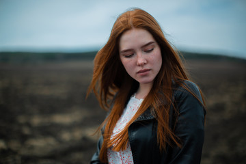 Fototapeta premium The melancholy young girl lowered her eyes modestly.