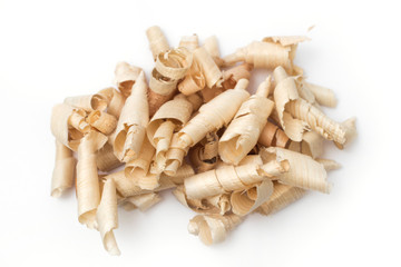 Wood shavings, beautifully curled in to a spiral isolated on white