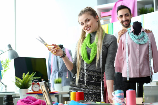 Two fashion designers at workplace creating