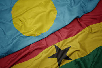 waving colorful flag of ghana and national flag of Palau