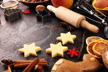 Baking christmas cookies. Typical cinnamon stars bakery with spices. xmas decoration on table