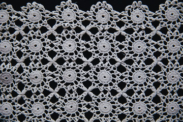 Beautifully shaped laces on black.