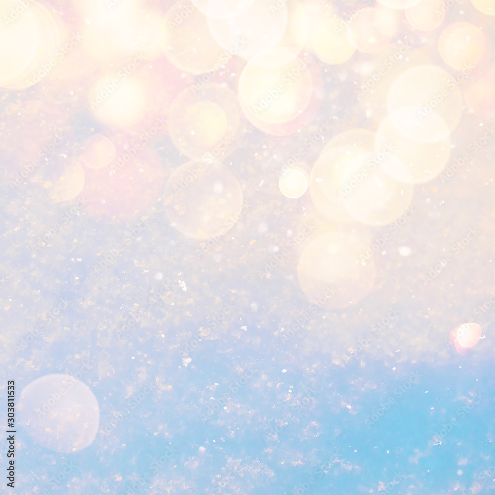 Poster Winter sunny snow texture background with warm lens flare bokeh lights