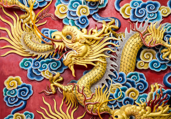 Fototapeta na wymiar Ancient statue of golden chinese dragon.