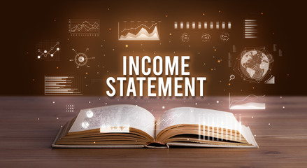 INCOME STATEMENT inscription coming out from an open book, creative business concept