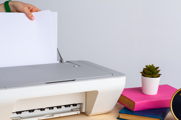 Close up of woman using a printer machine