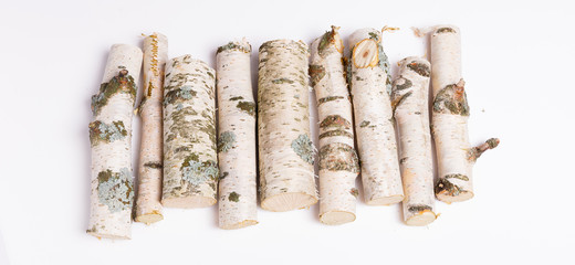 A pile of birch firewood on white background