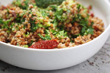 Buckwheat with vegetables, appetizing vegetarian dish. Buckwheat dish. 