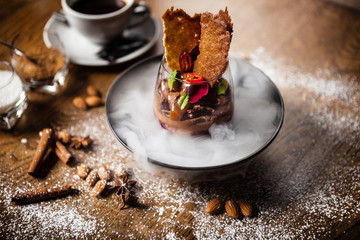 Chocolate mousse served with liquid ice smoke