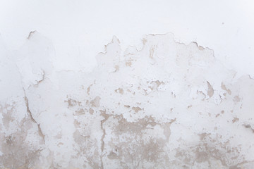 white concrete wall small cracks on the surface