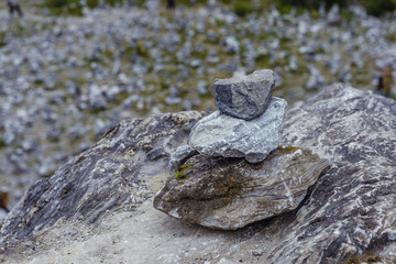 Make a wish. Pyramid of stones. Moss and stones