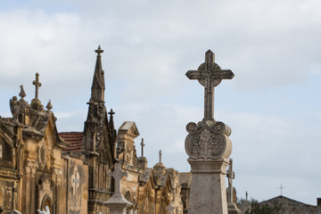 Fototapeta na wymiar Cross statue at the cemetery