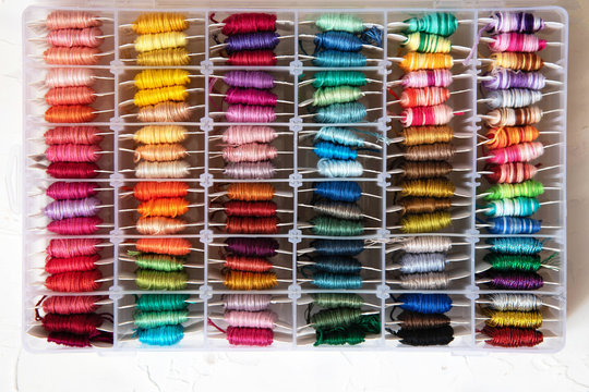 Set of multi-colored cotton threads. Colorful mouline threads. Top view