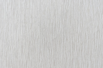 Fototapeta premium Rough white pleated relief stucco wall texture background. blank for designers