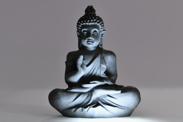 Buddha figure in beautiful light. Peaceful relaxation and meditation. Zen Buddhism.