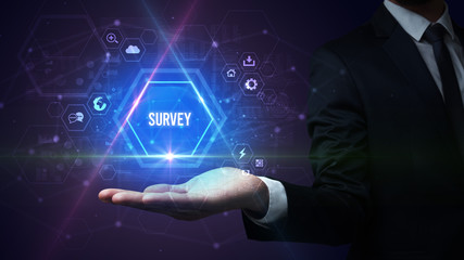 Man hand holding SURVEY inscription, social media concept