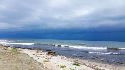 Fototapeta na wymiar wave on the sea coast and beautiful sandy beach. Beautiful cloudy landscape over the sea.