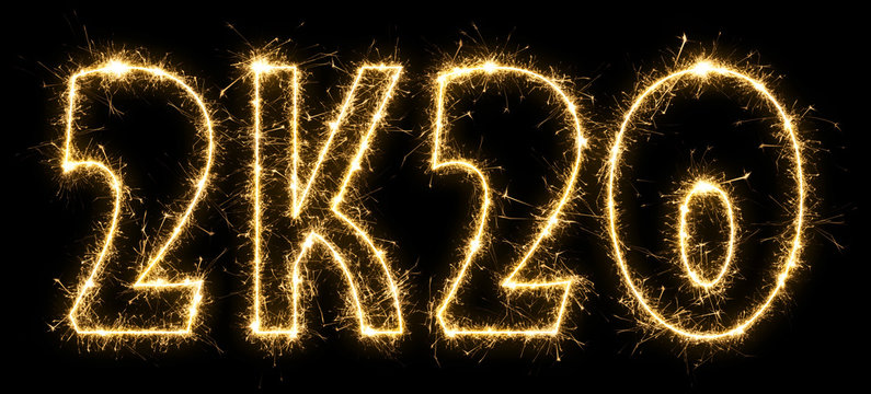 New Year 2K20 made by sparkler . Text 2K20 written sparkling sparklers . Isolated on a black background . Overlay template for holiday greeting card .