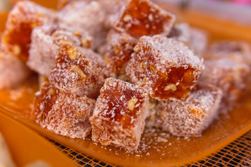 Different types, assorted. Tasty oriental sweets (Turkish delight lokum) with powdered sugar. bright and colorful sweets