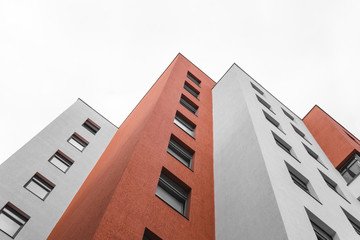 Office building, architecture background concept. red and white colour, geometric and white sky