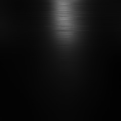 Black background shiny polished metal. Black metal texture background.