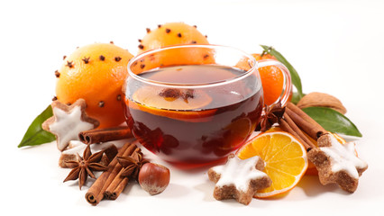 winter tea with orange, ginger bread and spices on white background