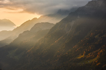 The last rays of the sun illuminate the slope of the Sätteli and the Gadmen valley, seen from the road to the suspension bridge of Trift (Triftbrücke). Switzerland