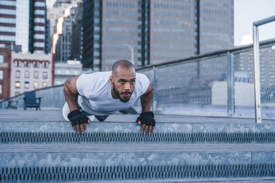 Athletic Black Man Doing High Plank Pose On Street