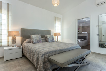 Modern bedroom with modern decor and furnishings.