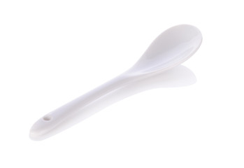 White ceramic spoon isolated on white background.
