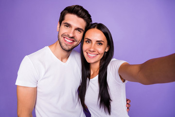 Naklejka premium Self-portrait of his he her she nice attractive charming lovely cute sweet cheerful cheery couple soulmate spending time hugging isolated on purple violet lilac color pastel background