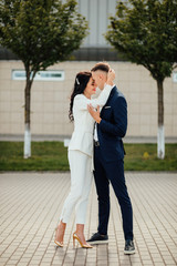 Happy couple while walking through the city street