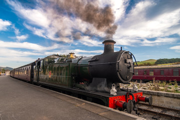 Fototapeta na wymiar Steam train at Yorkshire town of Bolton Abbey