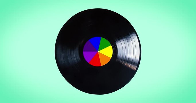 Rainbow black vinyl loop record isolated on white background.  The rainbow colors are used by the lgbt community. The disk is also called newton disk