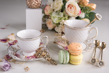 Christmas composition with flowers and white tea cups