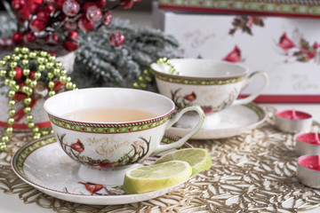 Obraz na płótnie Canvas Christmas composition with flowers and white tea cups
