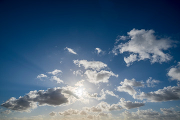 Naklejka na ściany i meble cloudscape with blue sky and sun for backgrounds